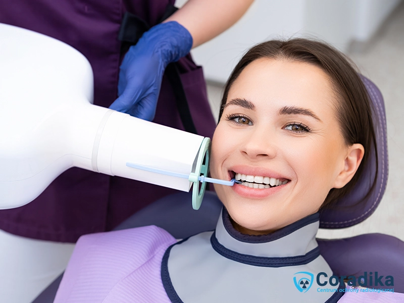 Woman in a dental office wearing an X-ray thyroid shield during a radiographic examination - Coradika